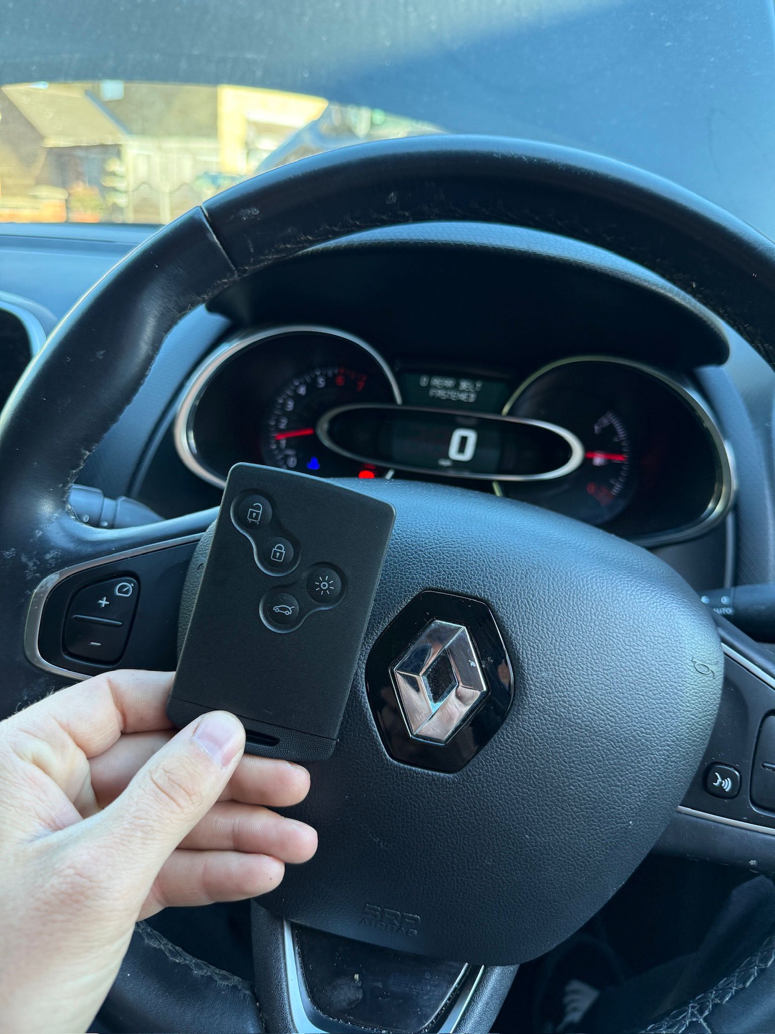 Matt auto locksmith cutting a car key on-site in Kettering